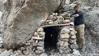 Building a room under a very large stoneFor shelter in the mountains