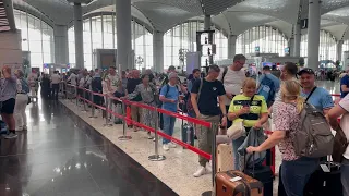 Manchester City fans at Istanbul Airport try to make Monday's trophy parade