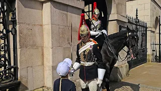 CHINESE KID BLOCKS THE KING'S GUARD. Kid refuses to move until he has a picture at Horse Guards!