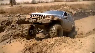 Jeep Grand Cherokee ZJ goin deep on 36" Super Swappers 11 inch Homemade long arm Lift kit Axle Swap