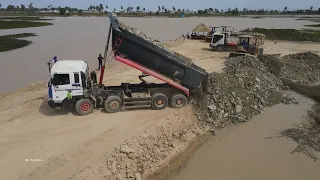 Wonderful Mighty Dump Truck Unloading of Stone into Water on Construction Bulldozer Moving Extreme