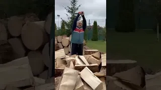 Belarusian President Alexander Lukashenko chopping firewood