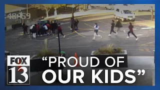Students, parents rush to rescue family run over in parking lot