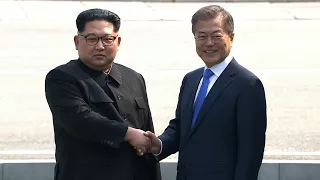North and South Korean leaders shake hands at the border