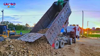 Heavy Dump Truck unloading Rock Soil,Strongly Dozer SHANTUI Smooth push Rock into water fill up land
