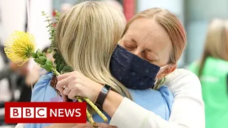 Joyful reunions as Australia's border reopens - BBC News