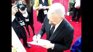 Bryan Cranston signs autographs for fans at the SAG Awards red carpet 2013