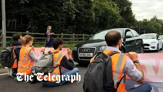 Protesters block several M25 junctions as police arrests at least 74 activists