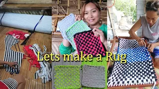 Making a rug using old clothes.