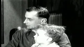 All the family members listen to a radio kept in the center of a room in the Unit...HD Stock Footage