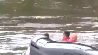 WATCH: Firefighters rescue woman trapped in flooded car in Baton Rouge