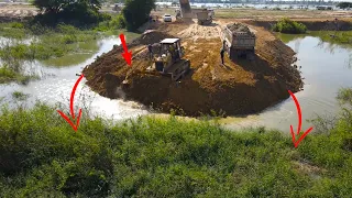 Fantastic Landfill Up with Talented Driver Bulldozer Push Soil and Heavy Dump Truck Moving In Water