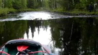 Canoeing Pirunkoski rapid, Kutujoki river, near Oulu, Finland