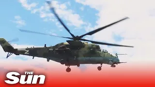 Russian attack helicopter destroying Ukrainian armoured vehicles