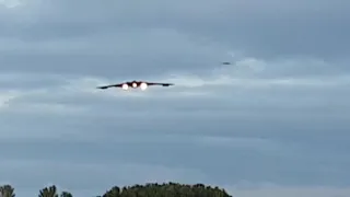 B2 stealth bomber landing into the sunset