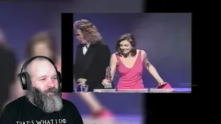 American Reacts to Bra-Less Liz Hurley Befuddling Billy Connolly at the BAFTAs