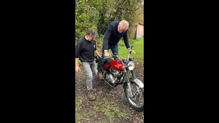 Man learns how to kick start his '70s Norton Commando