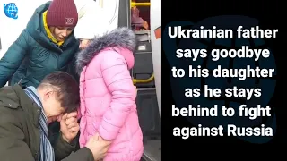 Ukrainian father says goodbye to his daughter as he stays behind to fight against Russia#ukraine