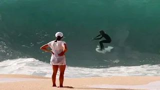 Surfers Attempt to Ride Waves Dangerously Close to the Beach on Tiny Surboards