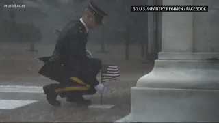 Moving photo captures flag being placed at Tomb of Unknown Soldier during severe rainstorm