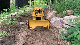 Rc road construction. Repairing road damage using DXR2 hydraulic dozer.