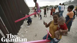 US border wall see-saws allow children on each side to play together