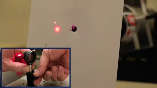 Aligning a lens to a laser beam