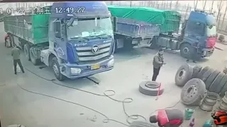 Tyre explodes while being inflated, almost knocking Chinese worker off his feet