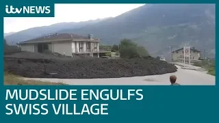 Huge mudslide sends people running in Swiss village | ITV News