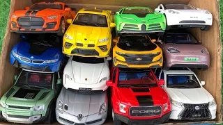 Box Full of Model Cars -Mercedes Slr, Lamborghini URUS, Porsche Taycan, Bugatti La Voiture, Model 3