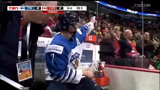 Urho Vaakanainen  signs an autograph for a fan while serving a penalty.