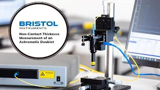 Non-contact thickness measurement of an optical doublet with the 157 Optical Thickness Gauge