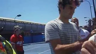 Federer signing autographs, up close, greeting the camera - Australian Open 2012