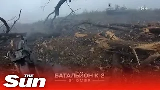 Ukrainian troops blast Russian tanks with rifles from trenches in first-person footage