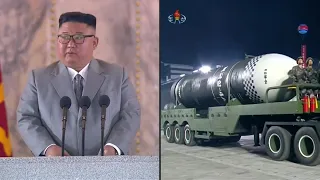 North Korea shows off giant missiles at huge military parade | AFP