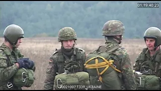 NATO troops parachute out of German helicopters in PfP exercise. Ukraine, 2002