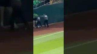 Oakland Athletics fan runs on field as crowd stages reverse boycott in protest of ownership