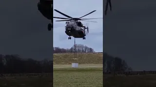 German Sikorsky CH-53G Transport Helicopter lifting a heavy sling load.