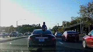 MOTHER SPEEDS DOWN A HIGHWAY WITH HER CHILD ON THE ROOF OF HER CAR