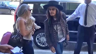 Steven Tyler Catches Flight With Pup And Mystery Blonde