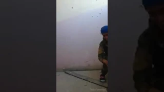 Kurdish sniper almost hit (laughs it off!)