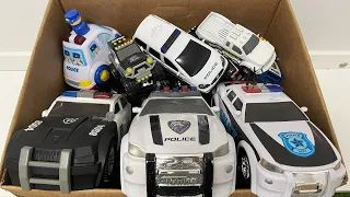 A Box Full of Police Cars Mini Cars Lined Up Checked Run one by one on a Slope to the Police Station