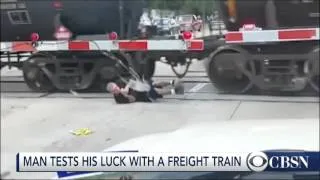 'Crazy' Man Rolls Under Moving Freight Train