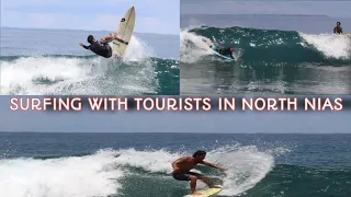 SURFING WITH TAURISTS IN NORT NIAS