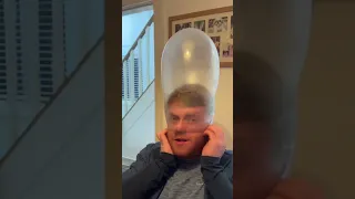 Blowing up a condom with nose only!