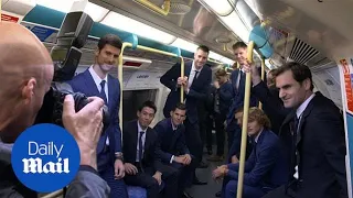 Roger Federer and Novak Djokovic enjoy a ride on the tube