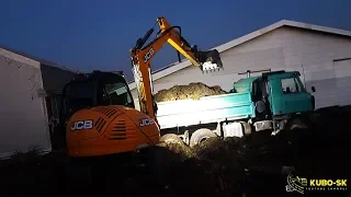 JCB 8085 excavator digging clay and loading Tatra truck - night work