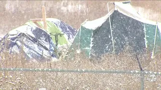 Handful of migrants choose to battle bitter cold in Denver encampment