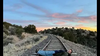 EMILY PRESCOTT: Extreme trainspotting for Ewan McGregor as he is pictured lying across railway track