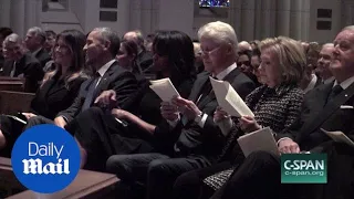 Obama appears to joke with Melania at Barbara Bush's funeral - Daily Mail